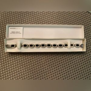 Nikken Bracelet, black and white detail.